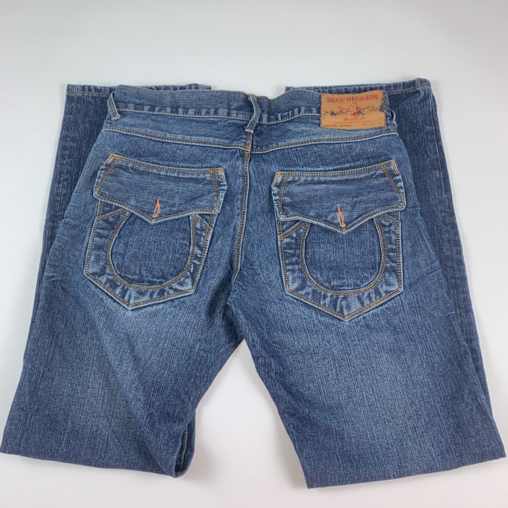 True Religion blue jeans no back pocket buttons